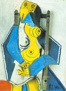 パブロ・ピカソ Painting - 肘掛け椅子に座る女性 4 1940 年キュビスト パブロ・ピカソ